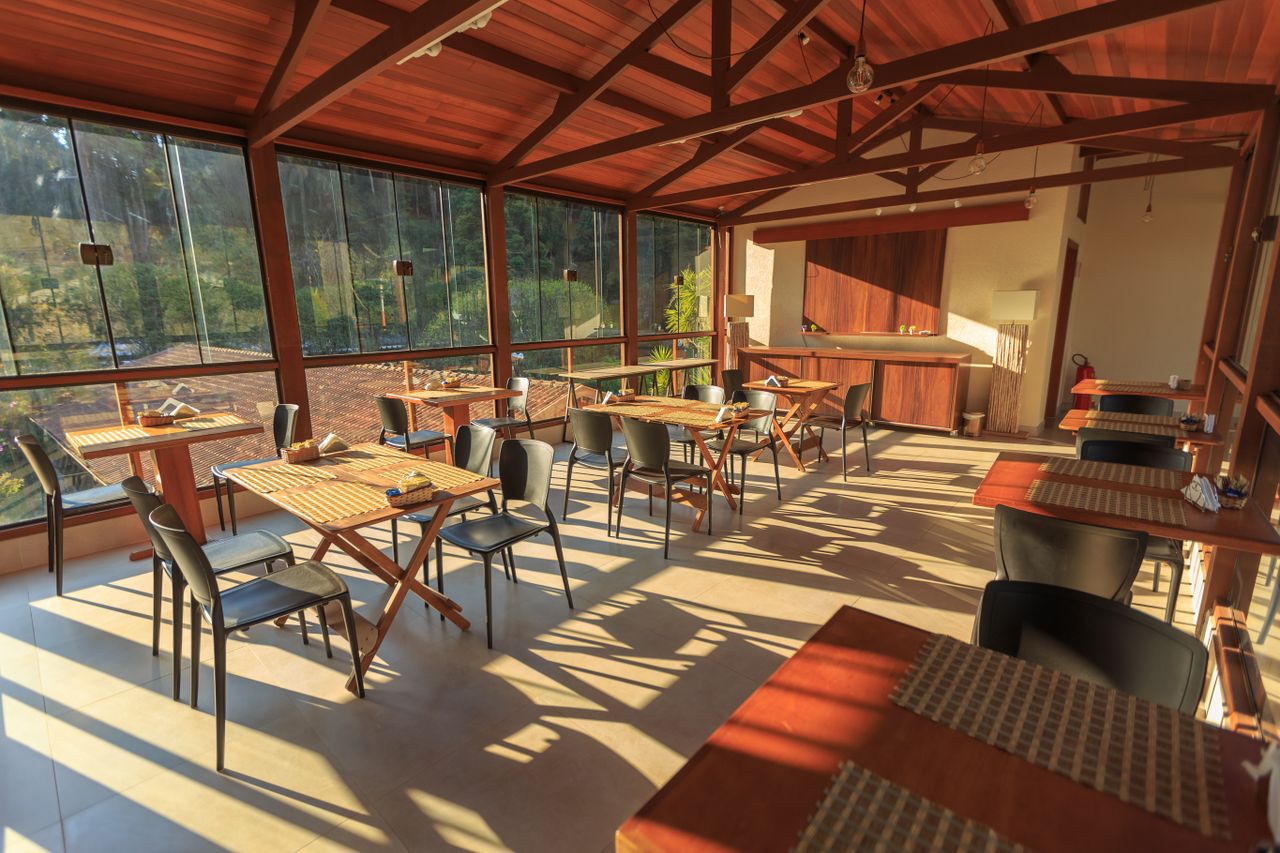 The warmly lit dining hall at Sri Manjunatha Bar and Restaurant